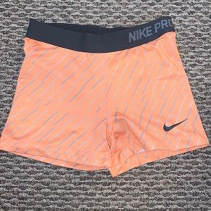 Orange and grey nike pros